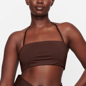 Skims, size large.  Strapless Bandeau Bikini Top.  NWT